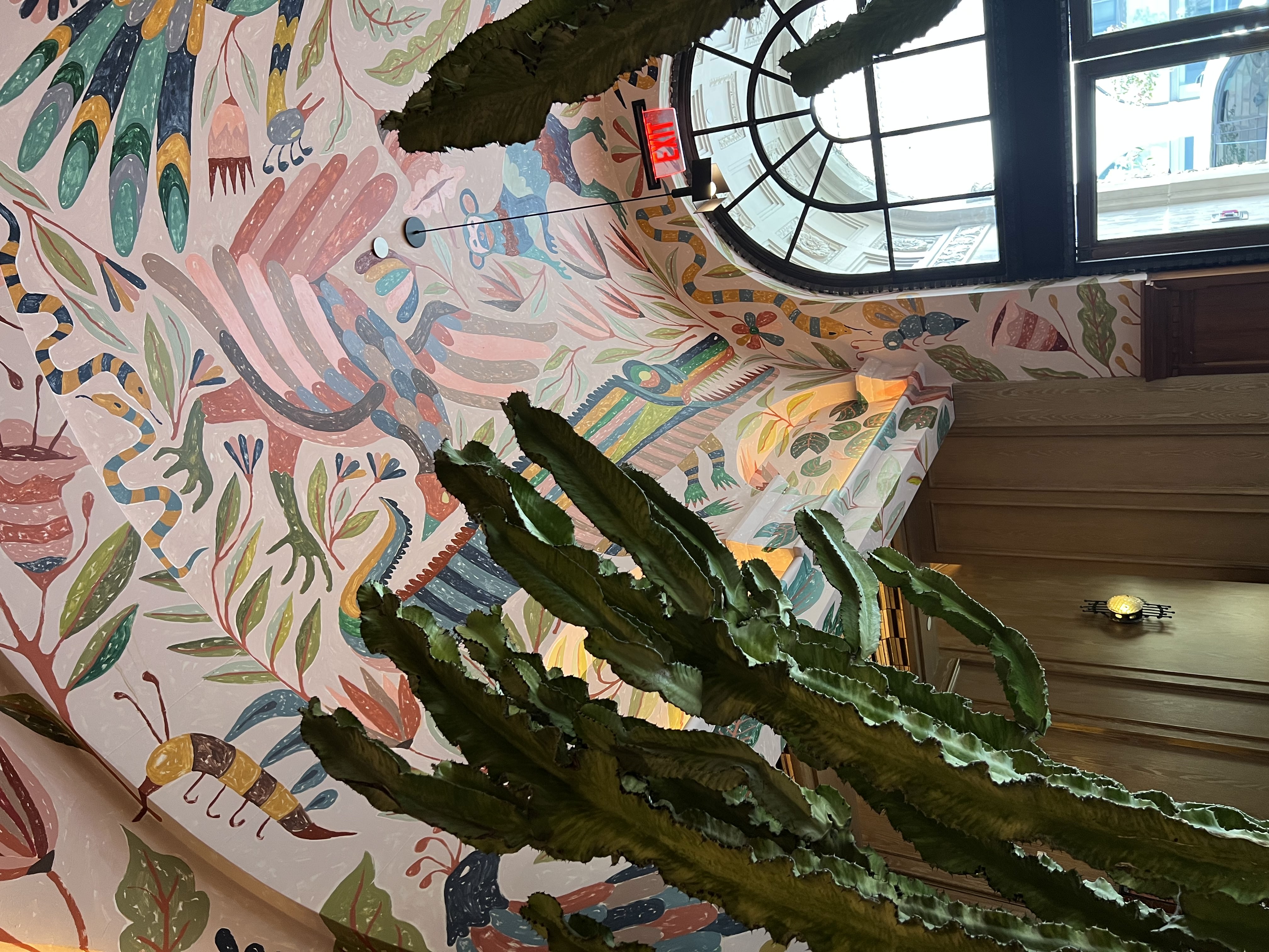 A picture of a wall with eccentric paintings.